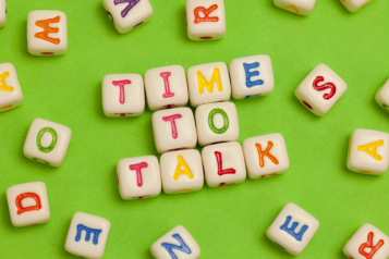 Colourful word tiles that spell out time to talk